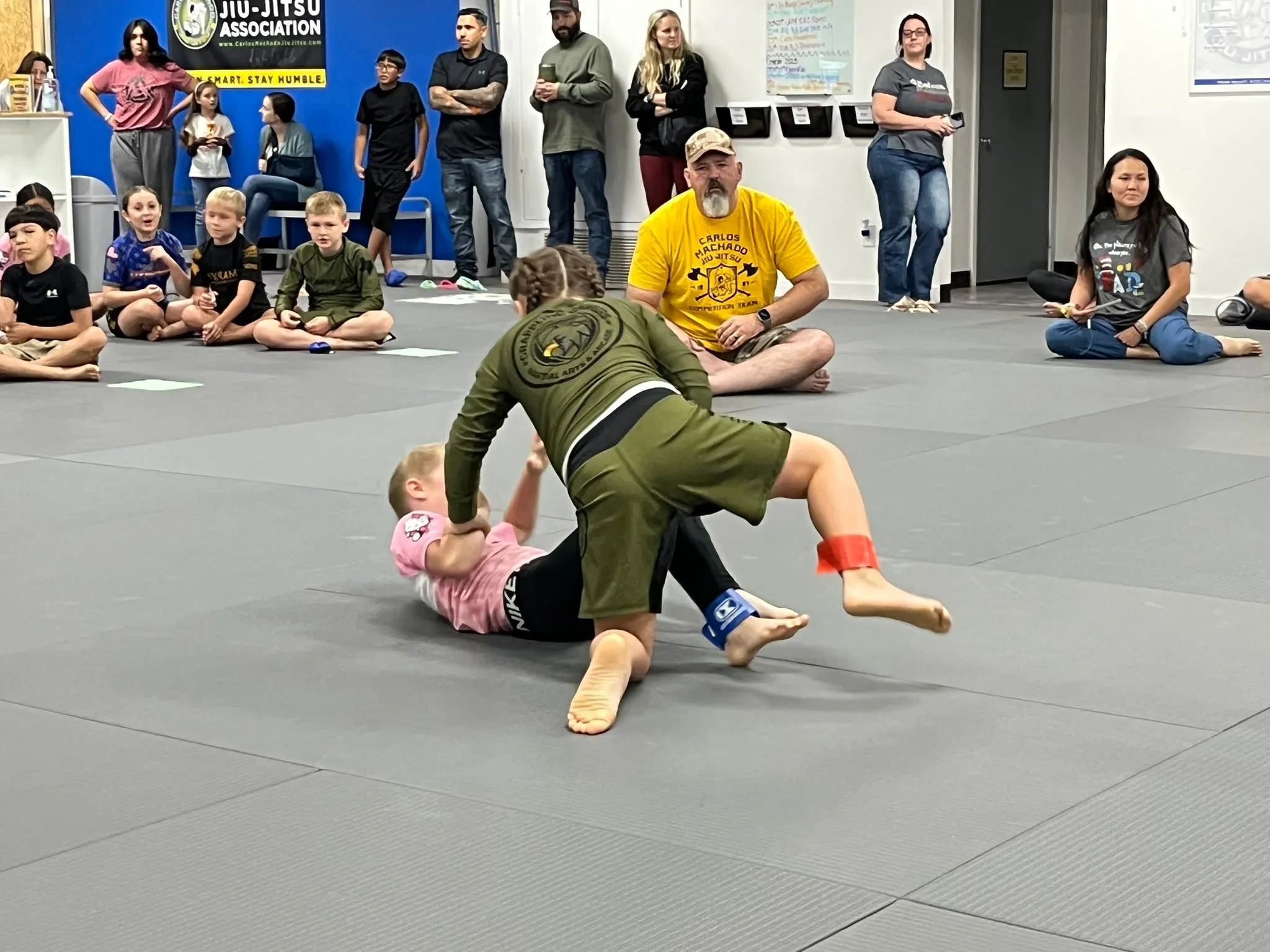 Adults rolling in the Gi during class at Dynamic Martial Arts