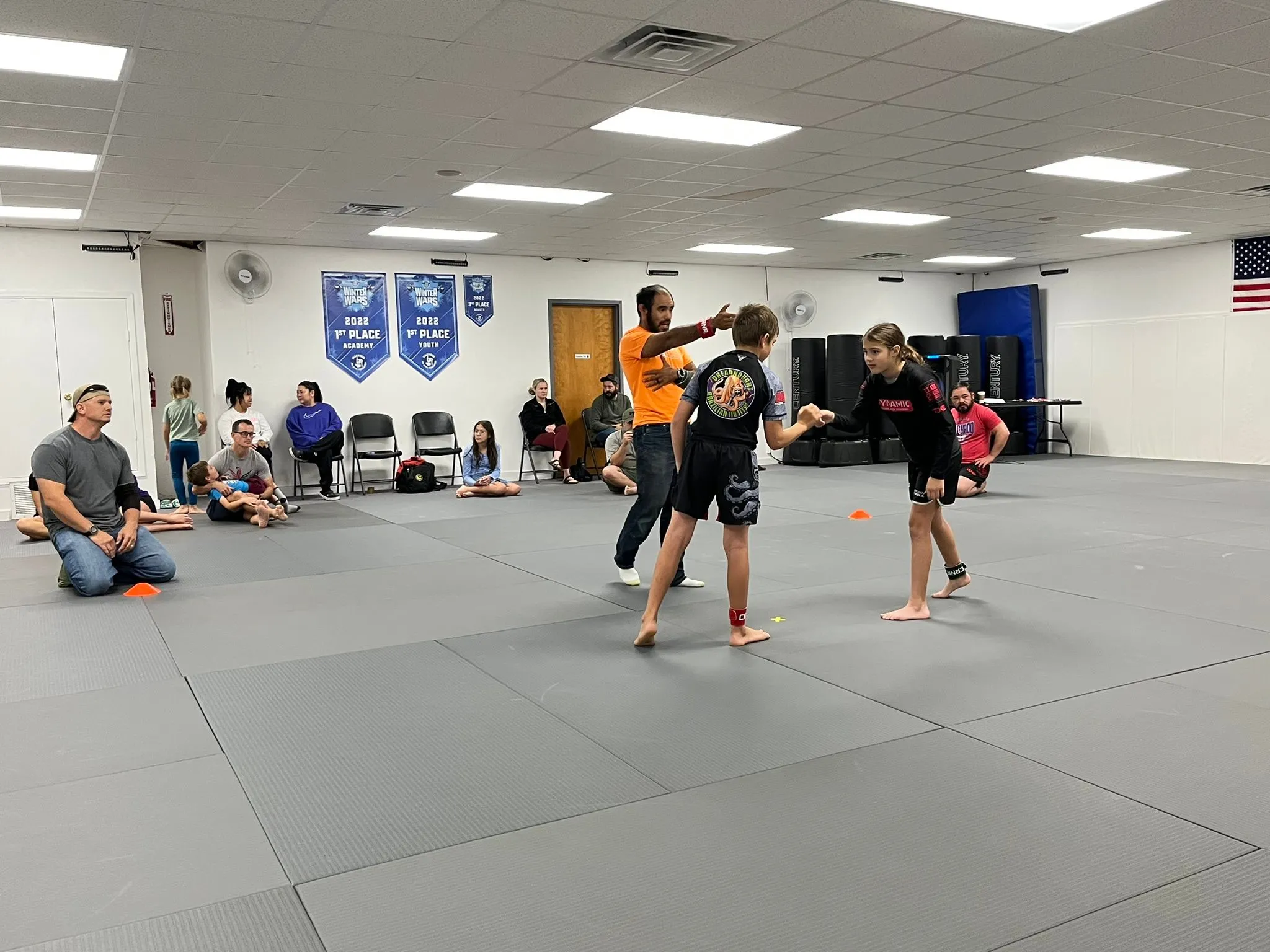 Adults working the pads during kickboxing class at Dynamic Martial Arts