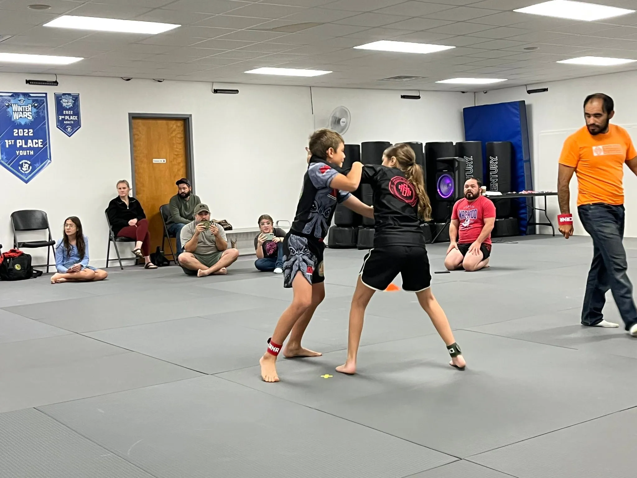 Kids in a standing exchange during class at Dynamic Martial Arts