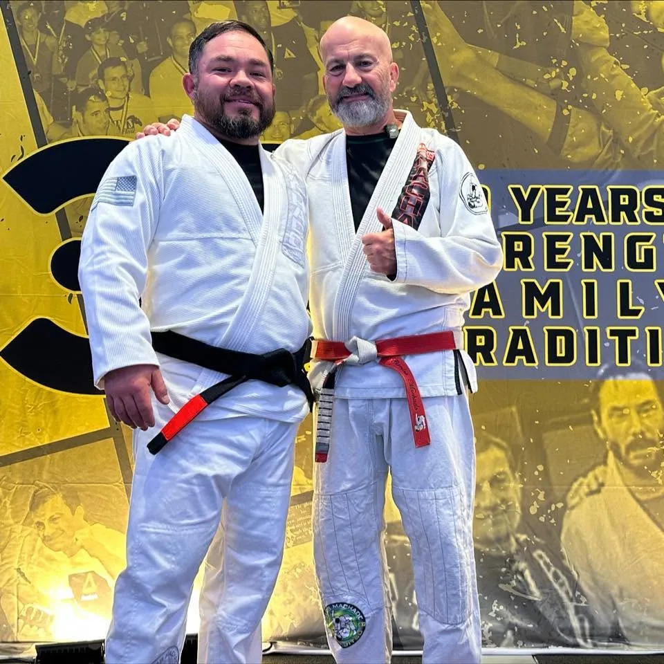 Roger Perez, Owner and Head Instructor and Black Belt under Carlos Machado, with Carlos Machado